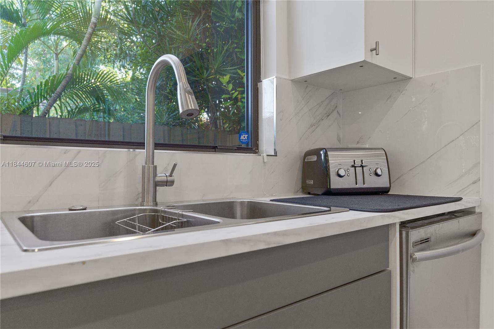 2887 Southwest 33rd Avenue Miami, FL 33133 - Photo 13 of 38 a close view of sink and tap