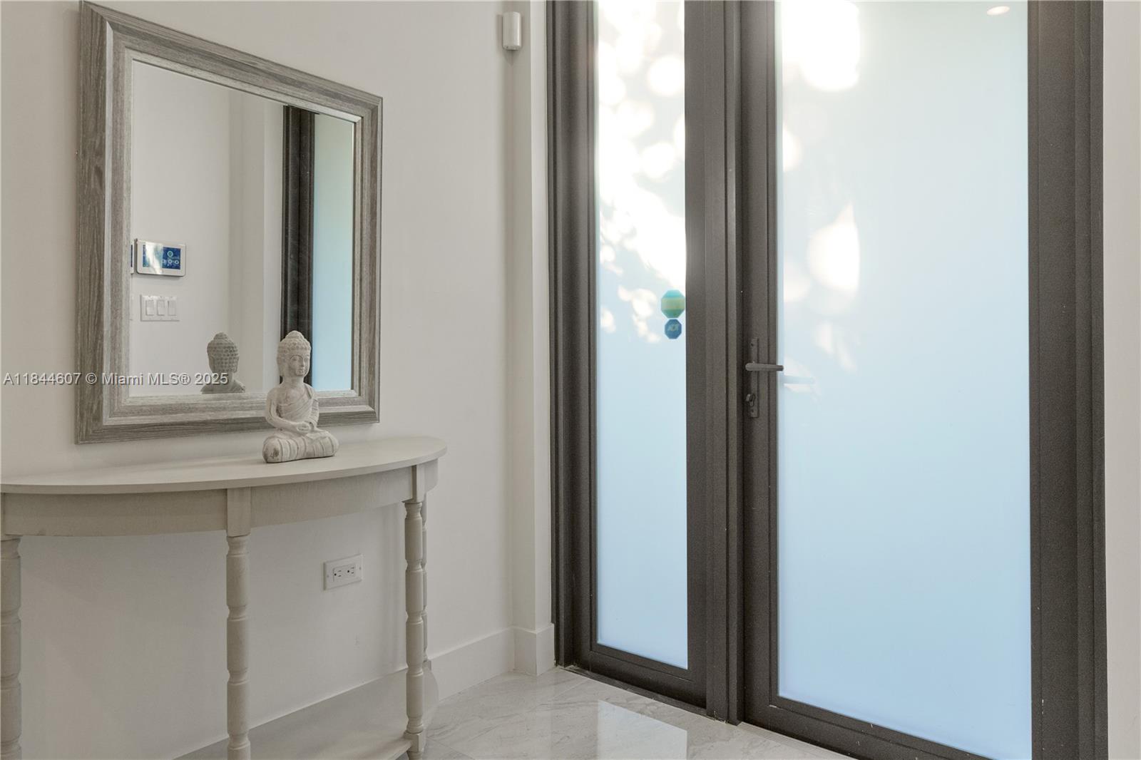 2887 Southwest 33rd Avenue Miami, FL 33133 - Photo 15 of 38 a bathroom with a sink and a mirror