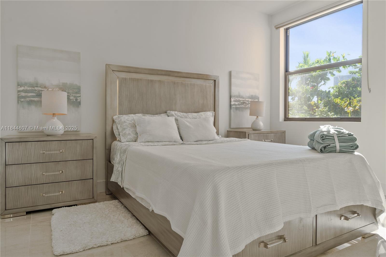 2887 Southwest 33rd Avenue Miami, FL 33133 - Photo 18 of 38 a bedroom with a bed and a painting on the wall