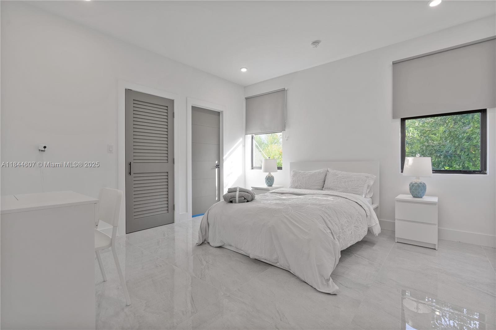 2887 Southwest 33rd Avenue Miami, FL 33133 - Photo 20 of 38 a bedroom with a bed and a window