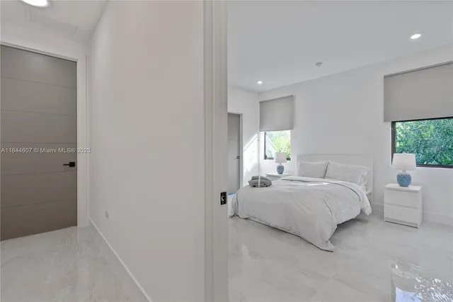 a bedroom with a bed and window