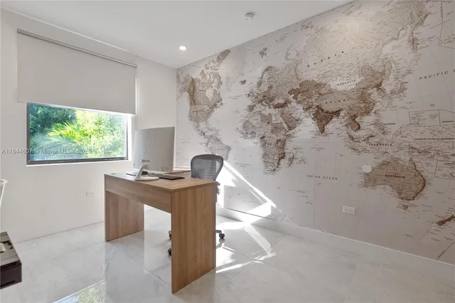 a view of a workspace with furniture