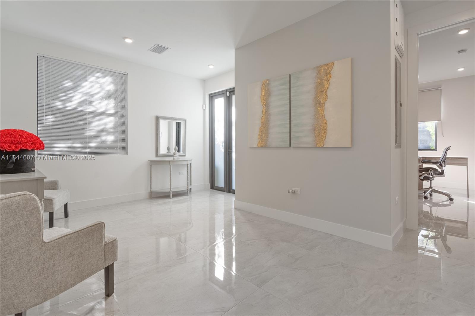2887 Southwest 33rd Avenue Miami, FL 33133 - Photo 28 of 38 a kitchen with white cabinets and window