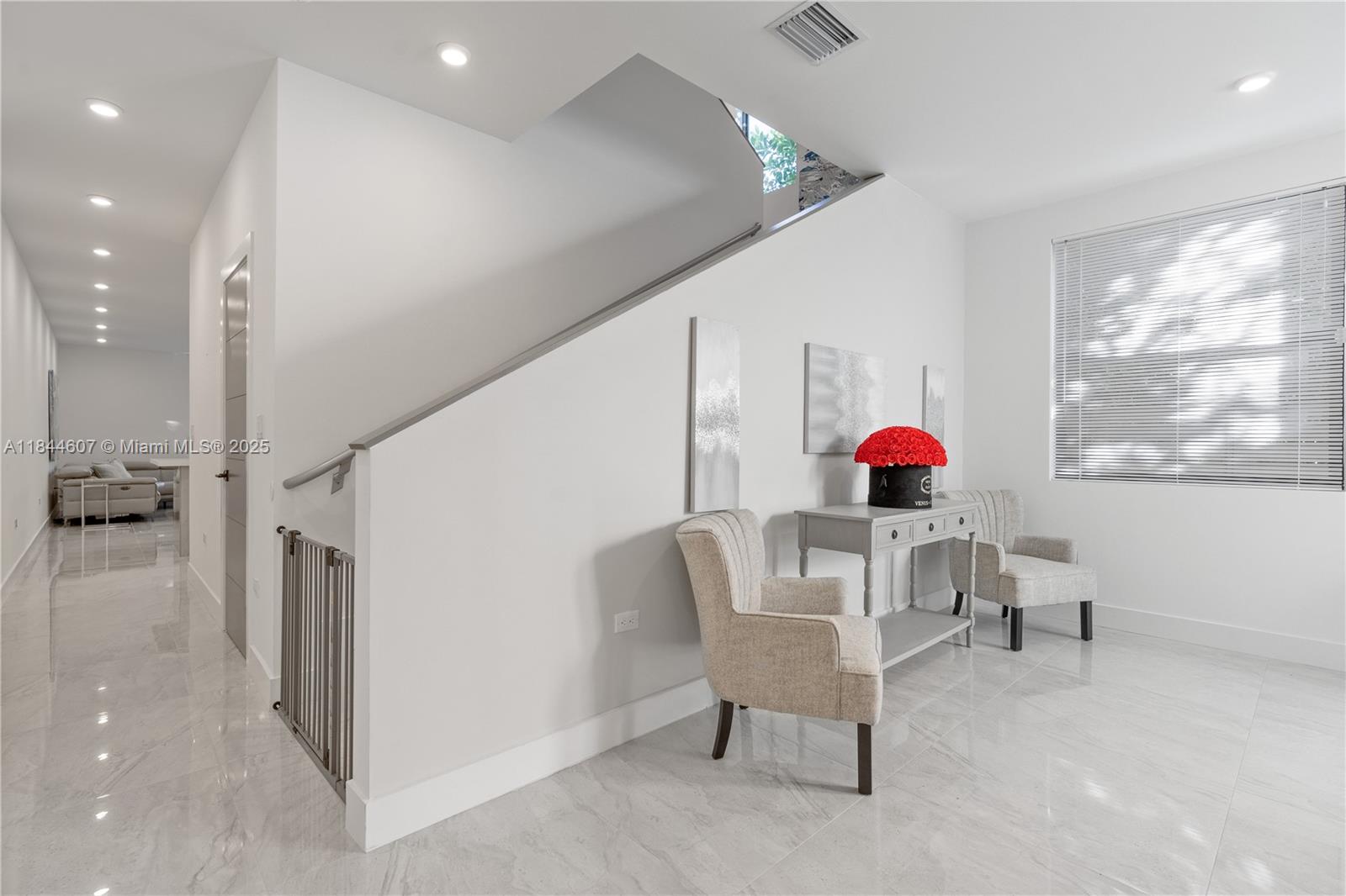 2887 Southwest 33rd Avenue Miami, FL 33133 - Photo 29 of 38 a living room with furniture and a flat screen tv