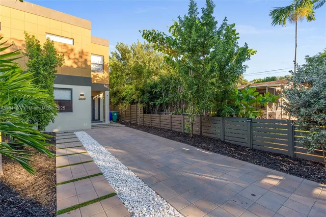 a view of a house with a street