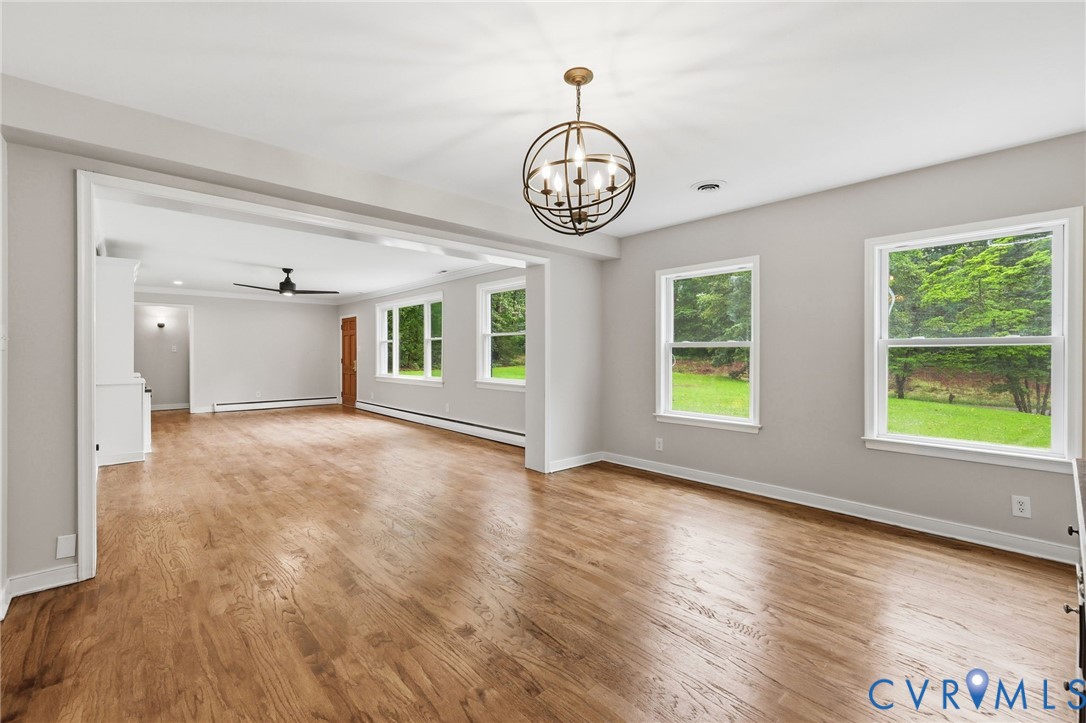 10152 Georgetown Road Mechanicsville, VA 23116 - Photo 14 of 35 a view of an empty room with wooden floor and a window