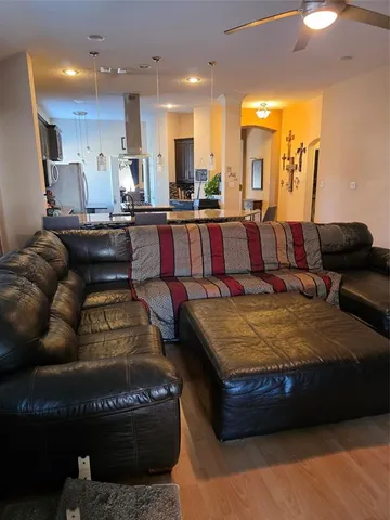 a living room with kitchen countertops and a couch