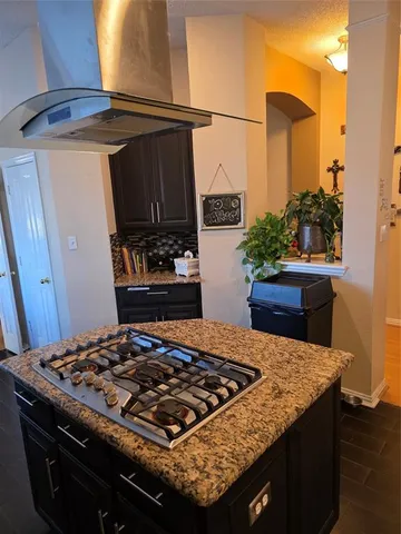 a kitchen with a stove and a cabinets