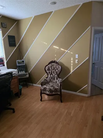 a room with gym equipment and a large window