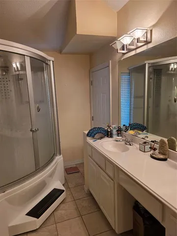 a bathroom with a sink a vanity and a mirror