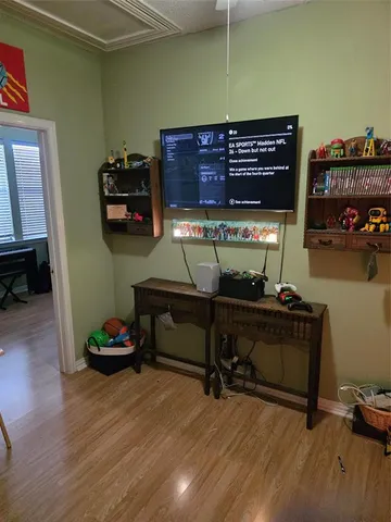 a room with furniture and wooden floor