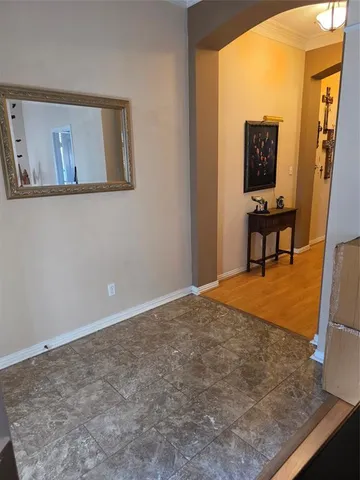 a view of a livingroom with wooden floor and chair