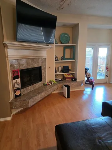 a bedroom with furniture and a fireplace