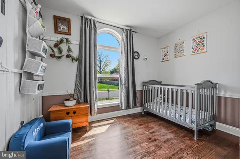 a bedroom with furniture and a window