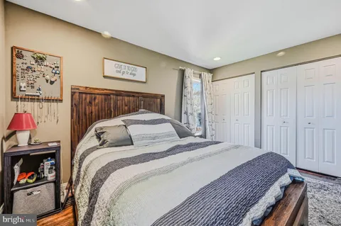 a bedroom with a bed and a walk in closet