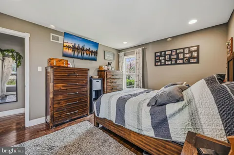 a bedroom with a bed and a desk