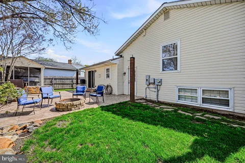 a view of a backyard with sitting area
