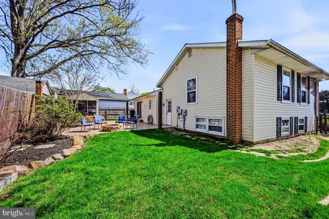 a front view of house with yard and seating area
