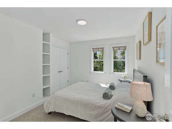 a bed room with a bed and a window