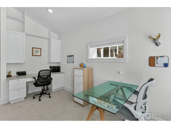 a view of a workspace with furniture