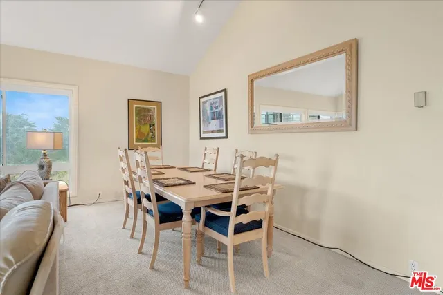 a bedroom with a bed couch and a window