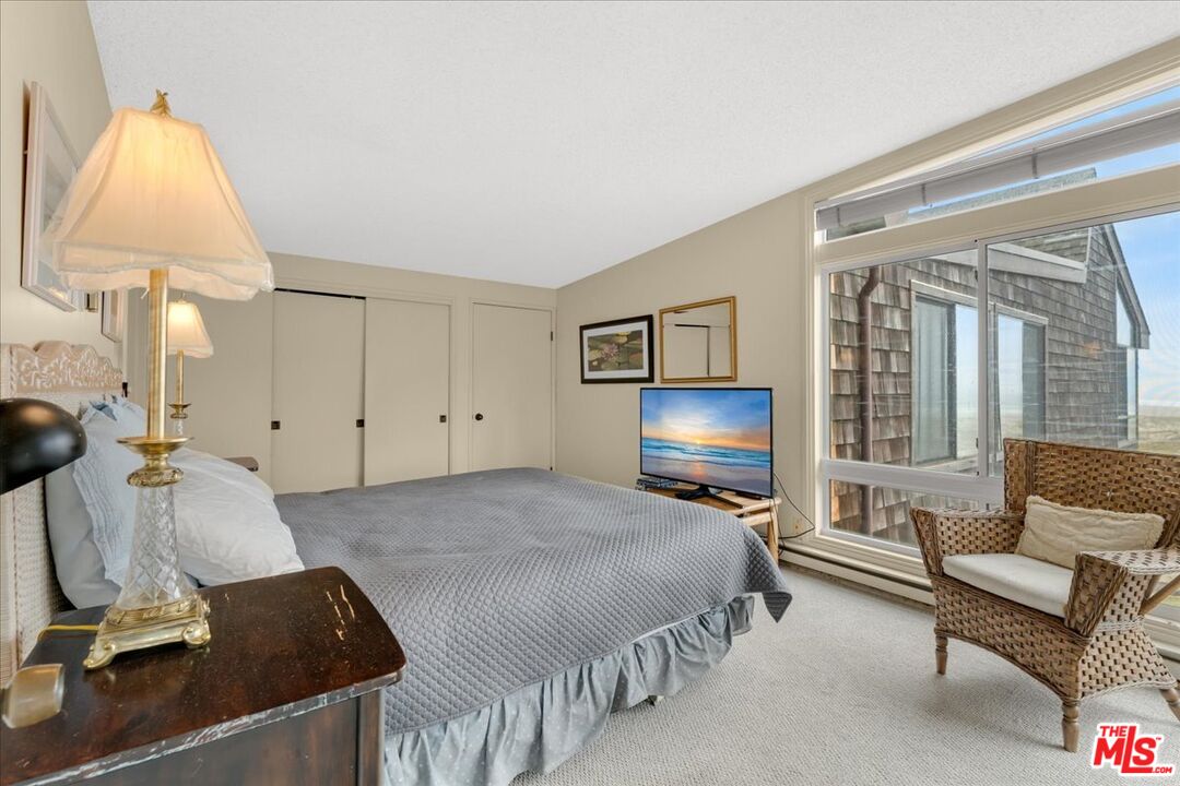 67 Pelican Point Watsonville, CA 95076 - Photo 12 of 25 a bedroom with a bed couch and a window