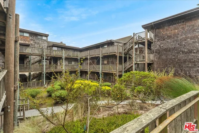 a view of a swimming pool with a patio and a yard