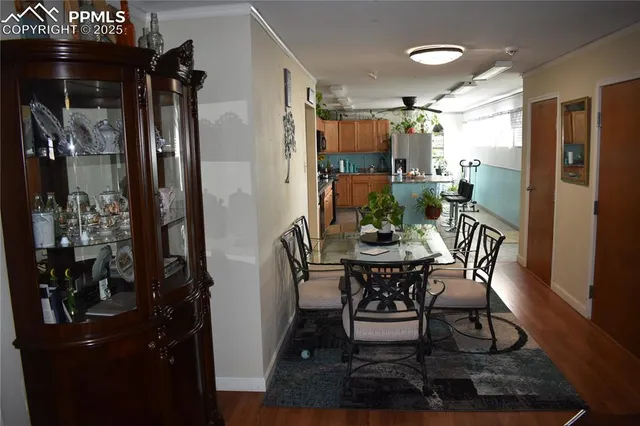 a view of a dining room with furniture and wooden floor