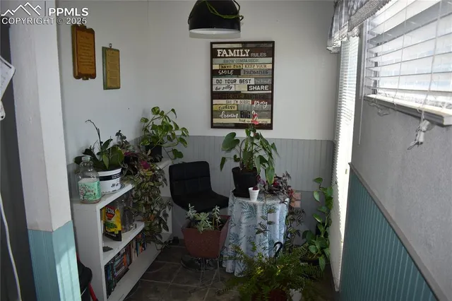 a kitchen with granite countertop kitchen island stainless steel appliances a sink stove and cabinets
