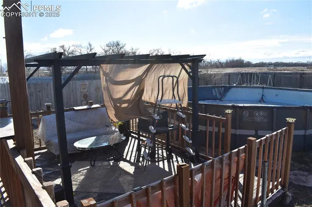 a view of a balcony with furniture