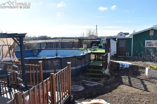 a view of a balcony with furniture