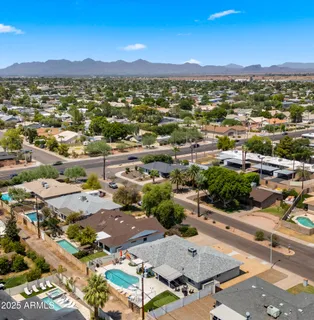 an aerial view of residential house and outdoor space