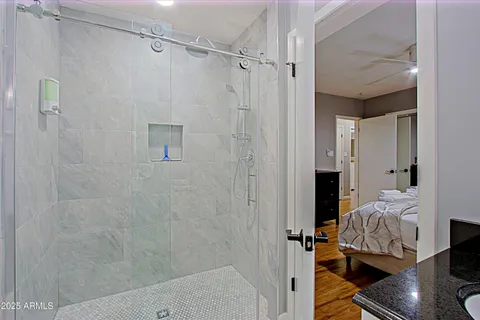 a bedroom with a bed and a window