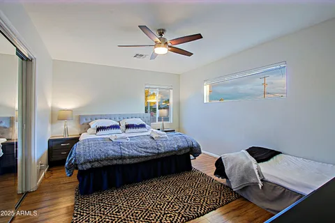 a bedroom with bed and window