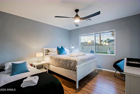 a bedroom with a bed and a window