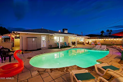 a view of a swimming pool with a patio
