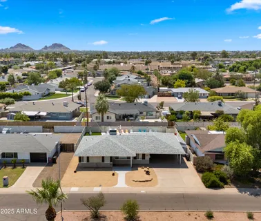 an aerial view of residential houses with outdoor space