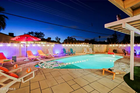 a patio with a table and chairs