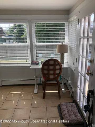 a workspace with furniture and a window