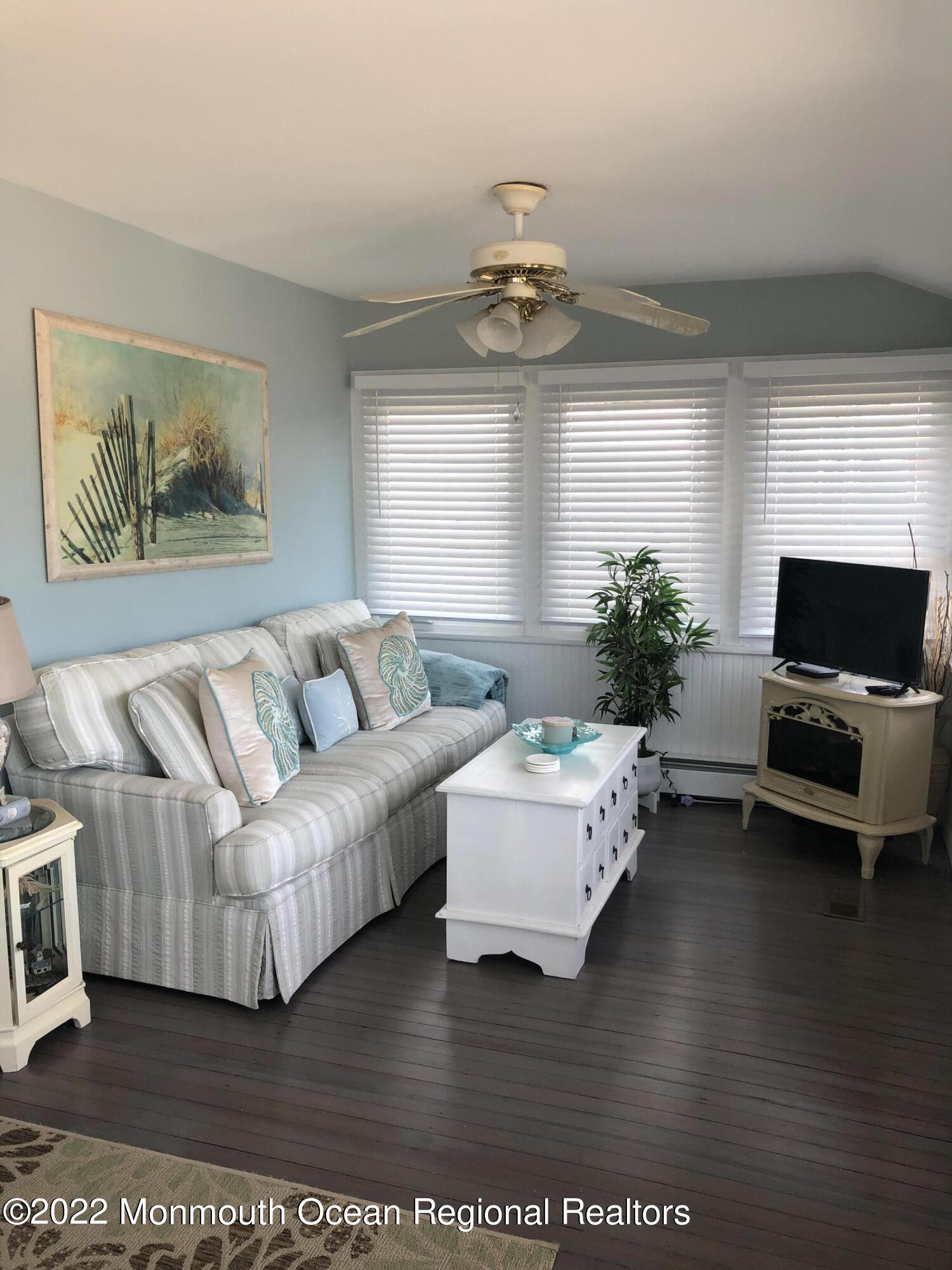 1717 River Road Belmar, NJ 07719 - Photo 18 of 25 a living room with furniture and a flat screen tv
