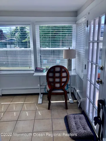 a workspace with furniture and a window