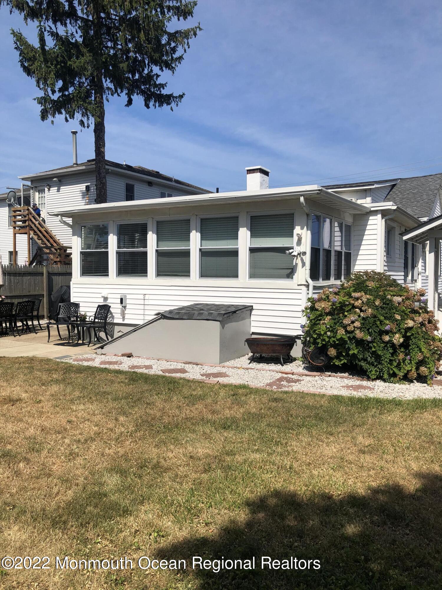 1717 River Road Belmar, NJ 07719 - Photo 20 of 25 a front view of a house with yard and seating space