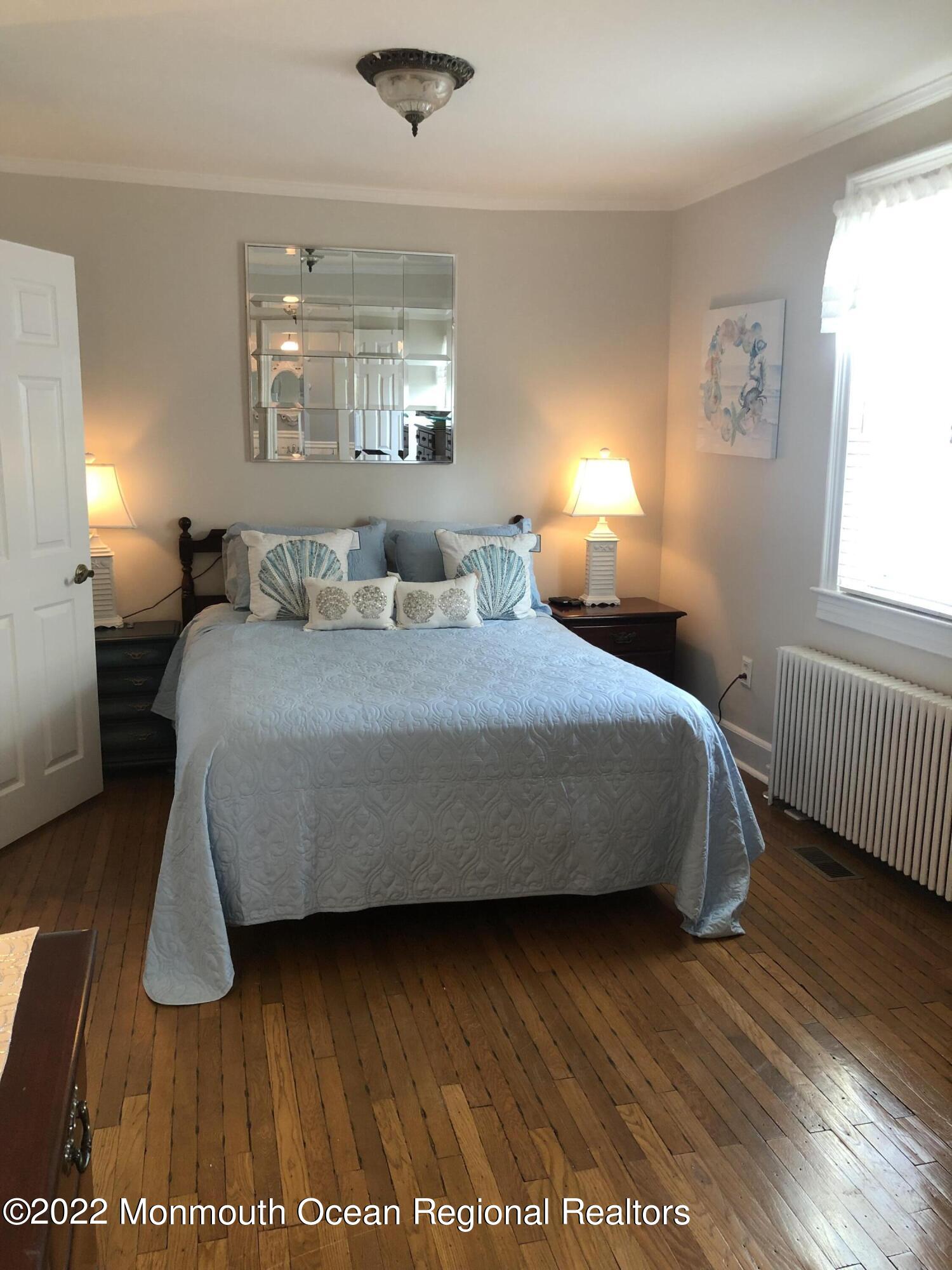 1717 River Road Belmar, NJ 07719 - Photo 7 of 25 a bedroom with a bed and window