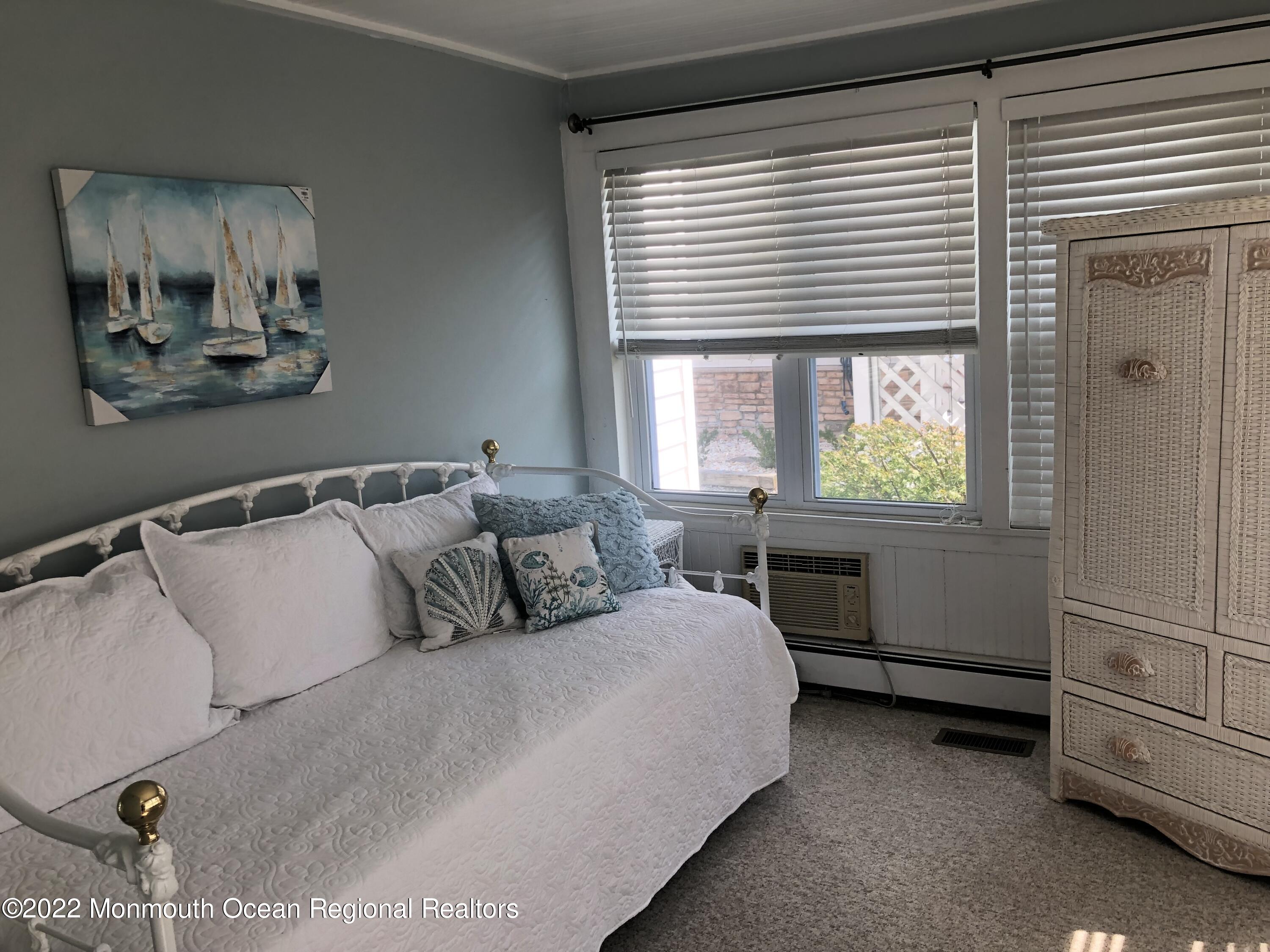 1717 River Road Belmar, NJ 07719 - Photo 10 of 25 a bedroom with a bed and a window