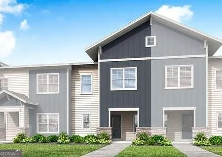 a front view of a house with a yard