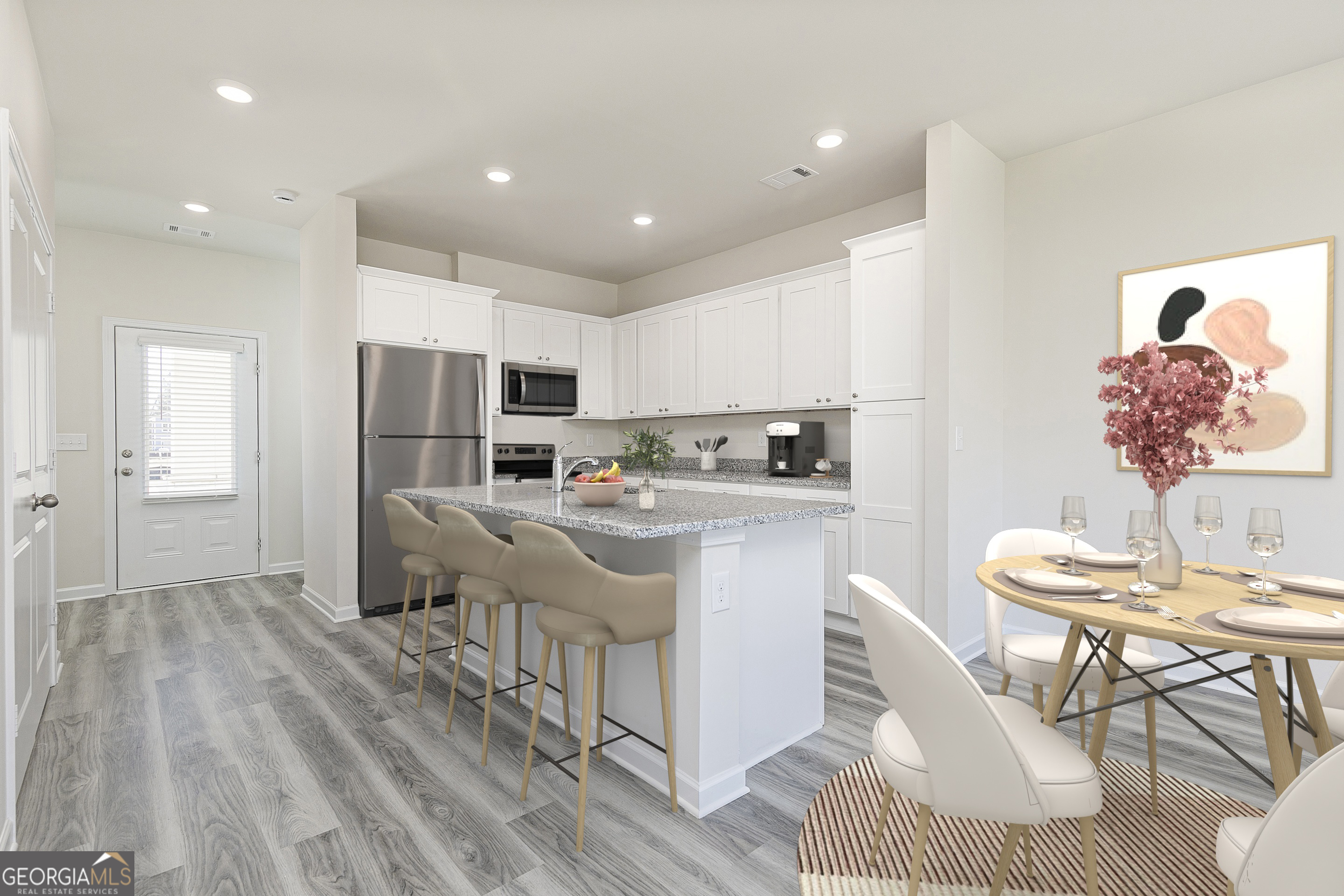231 Rooker Drive LaGrange, GA 30241 - Photo 4 of 17 a kitchen with stainless steel appliances granite countertop a refrigerator sink and white cabinets