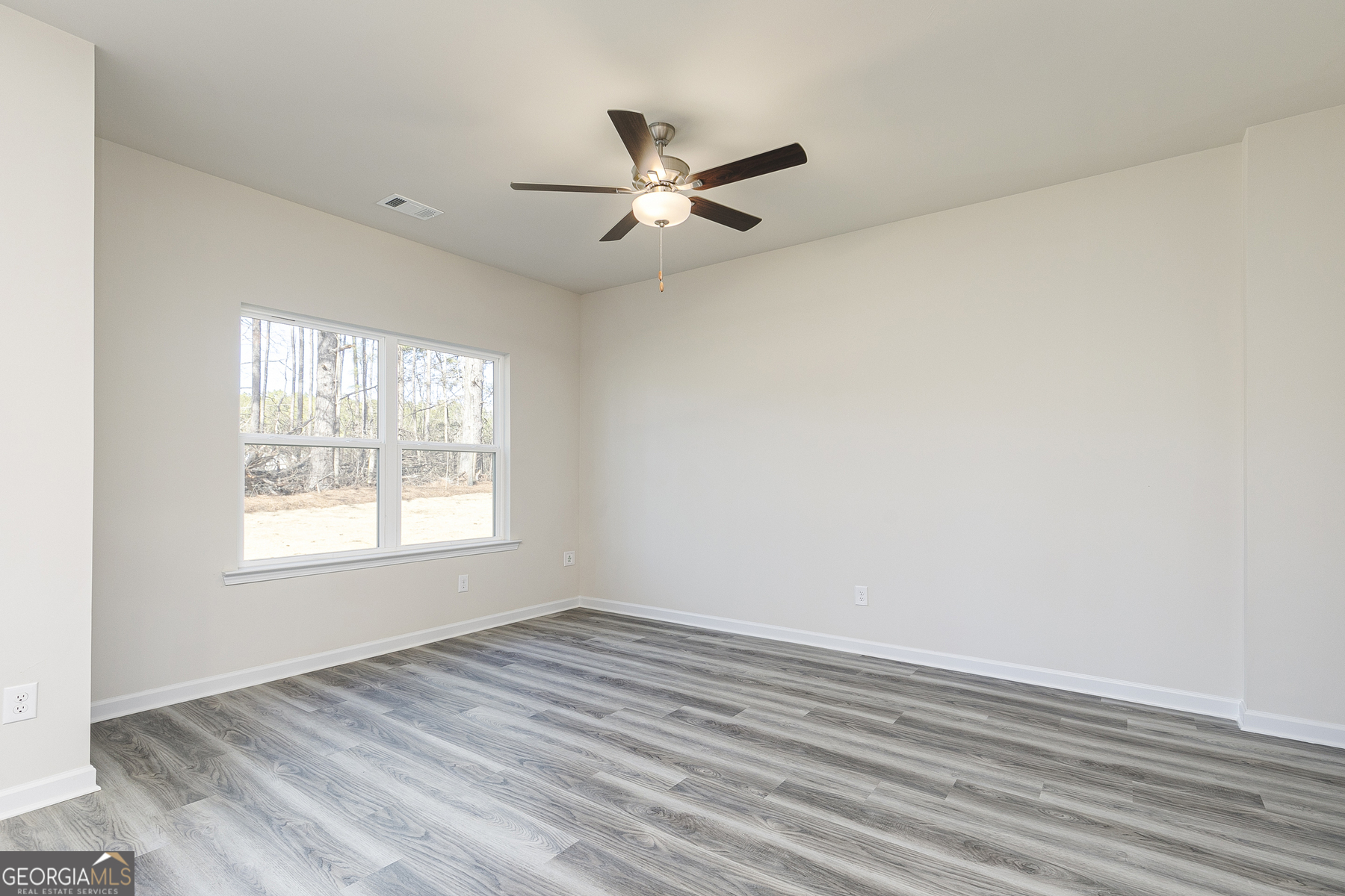 231 Rooker Drive LaGrange, GA 30241 - Photo 8 of 17 wooden floor in an empty room with a window