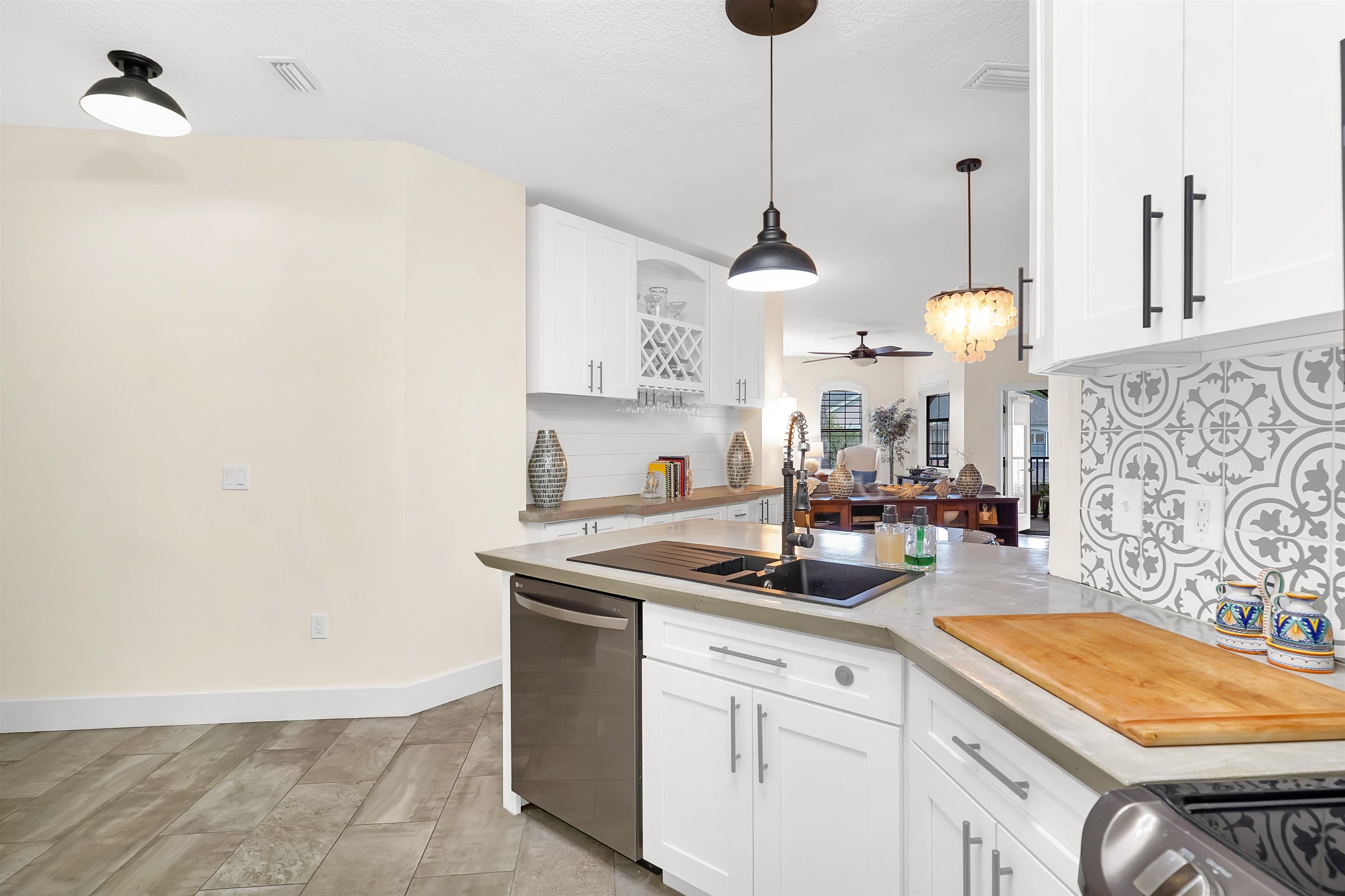 4629 Serena Circle St. Augustine, FL 32084 - Photo 12 of 47 a kitchen with stainless steel appliances granite countertop a sink a stove and a wooden floors