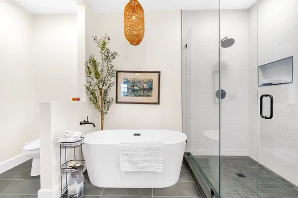 a bathroom with a tub and shower