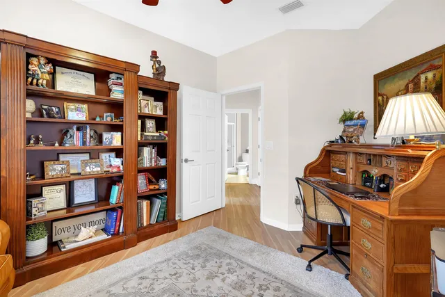 a workspace with furniture and book shelf
